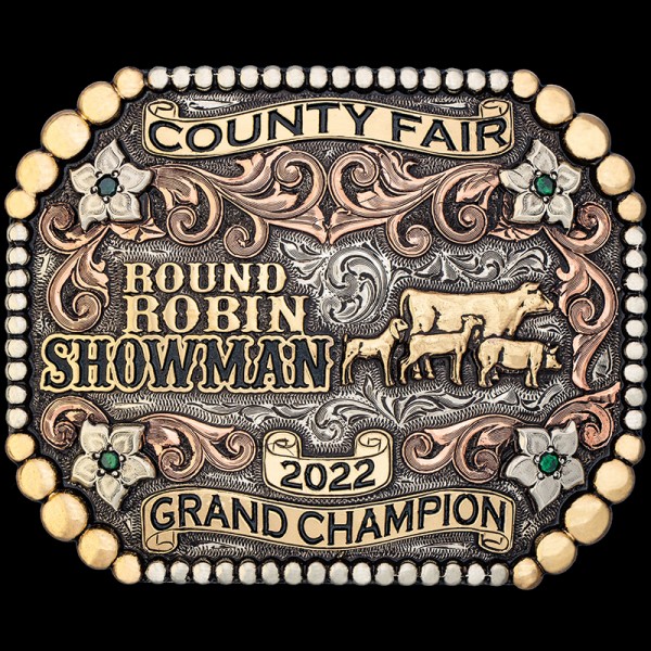 The County Fair Custom Belt Buckle features a berry edge, copper scrolls and bronze scrolls, and lettering. Customize it for a perfect rodeo trophy, gift or western accesory!